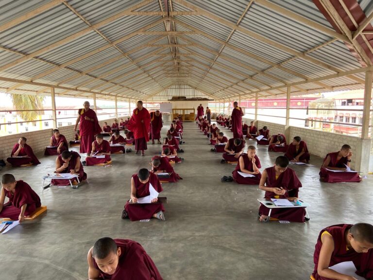 Students taking exam at roof top
